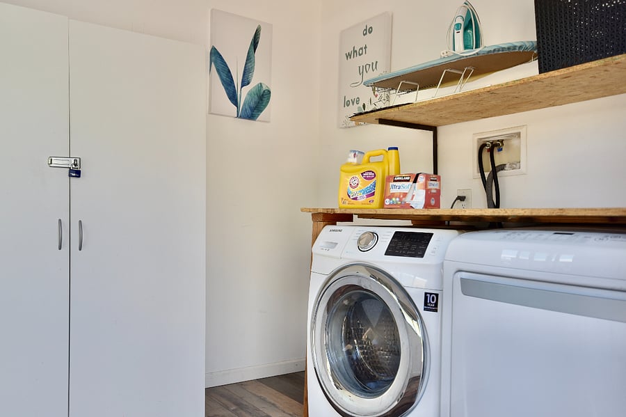 Laundry room is shared with 2 other units; features an electric washer and dryer.