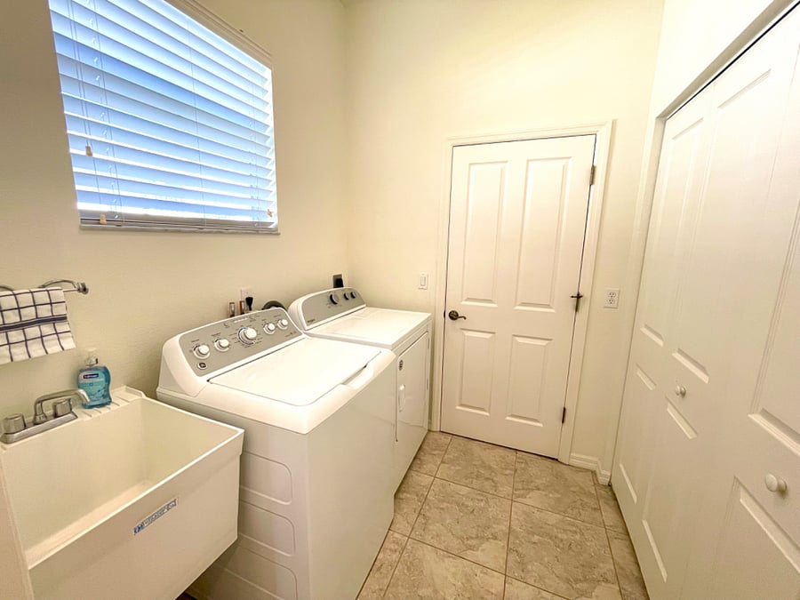 Laundry Room with Pantry/Storage and Access to Garage