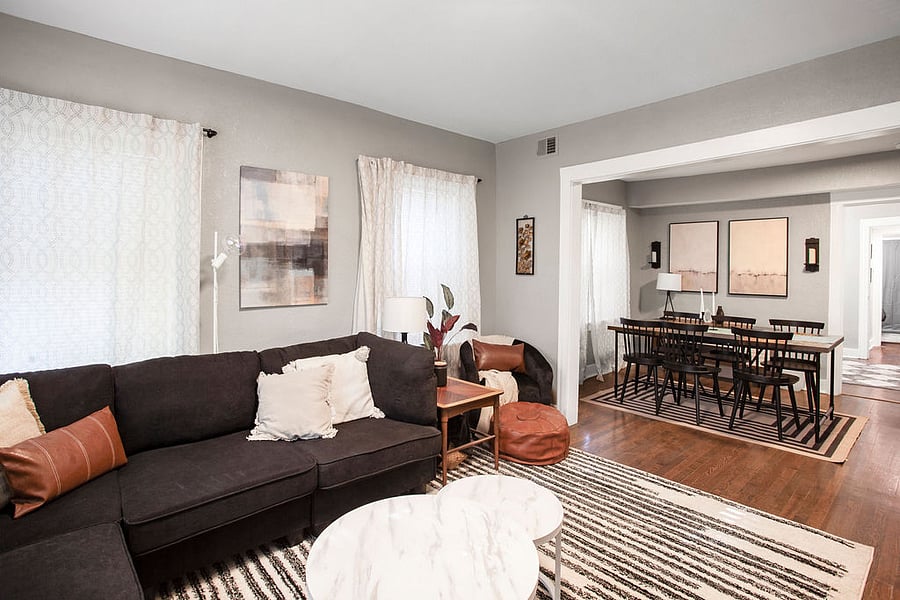 The large living room is newly designed and flows into the dining room. 