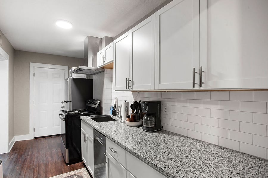 This updated kitchen offers stainless steel appliances and galley kitchen.