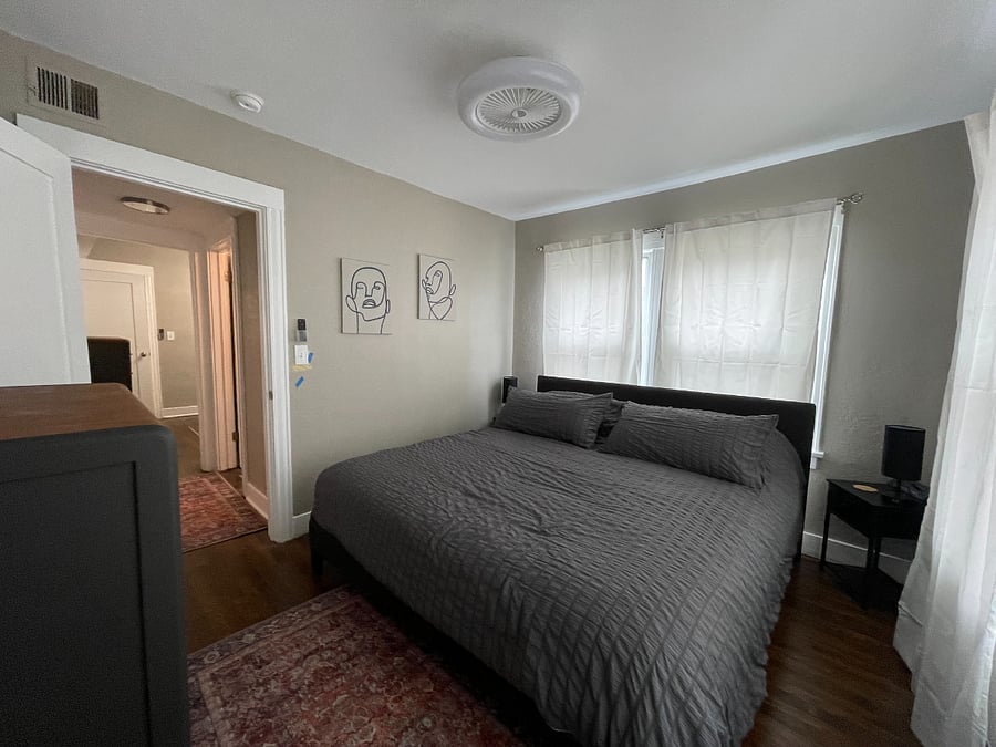 The back bedroom has a king bed and full blinds and sheet curtains when you want more light.