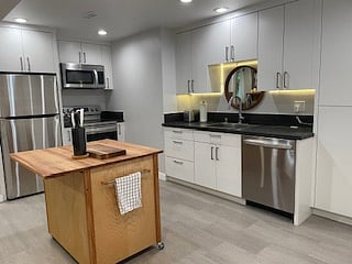 Kitchen with full-size refrigerator, stove with large oven, sink with dishwasher