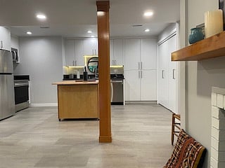 View from fireplace into kitchen and laundry