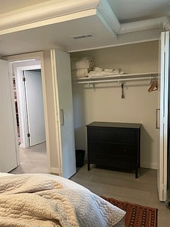 2nd bedroom closet with dresser