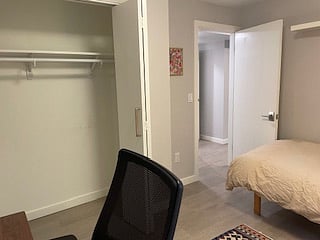 Office chair, daybed and hall view