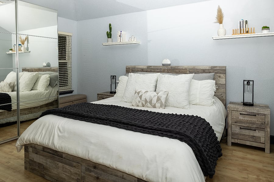 Master bedroom with king size Purple mattress, large Ikea closet with full size mirror, with bathroom attached.