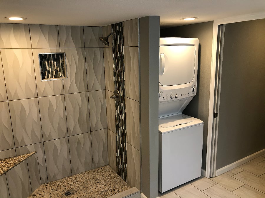 Full bathroom and washer/dryer unit in second bathroom.