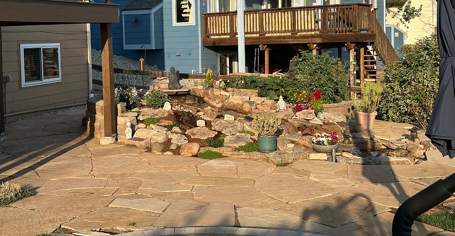 Pondless stream in backyard adds a touch of tranquility.