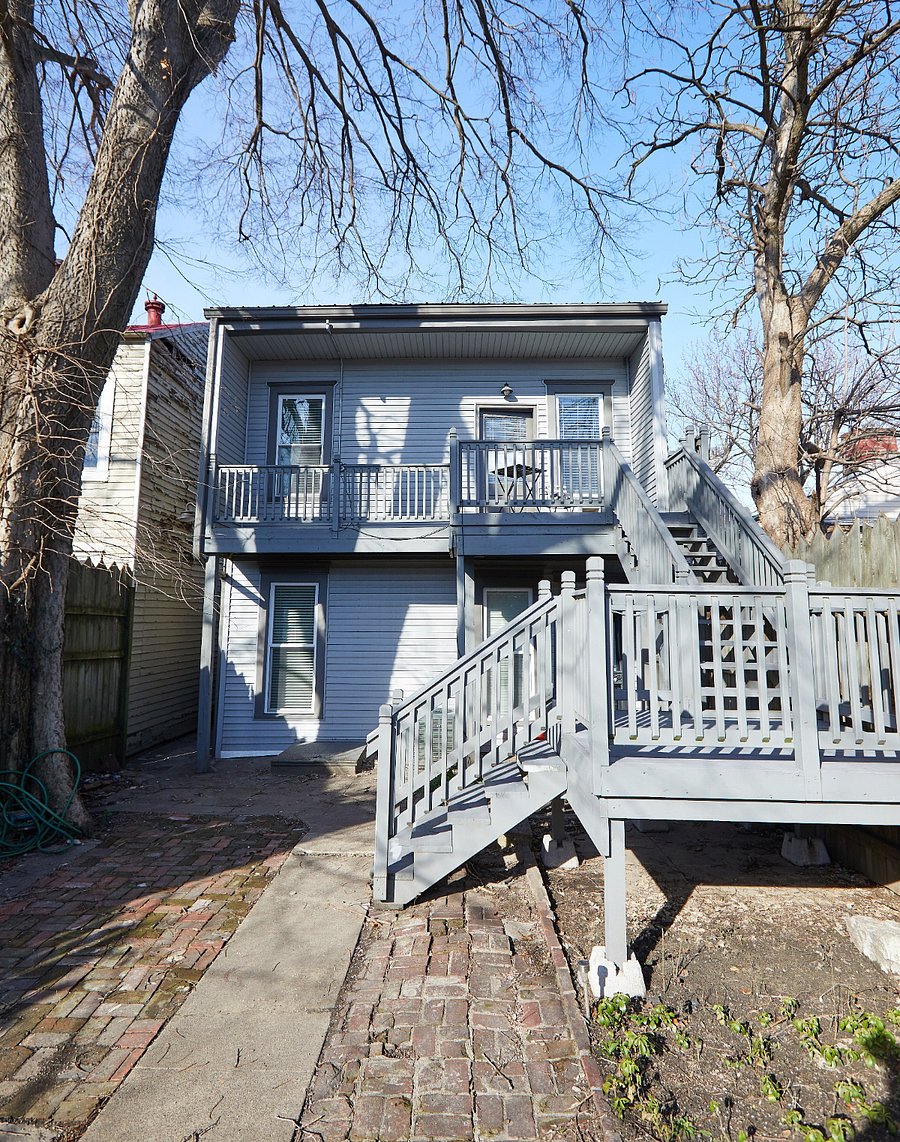 Access unit via stairwell in back yard.