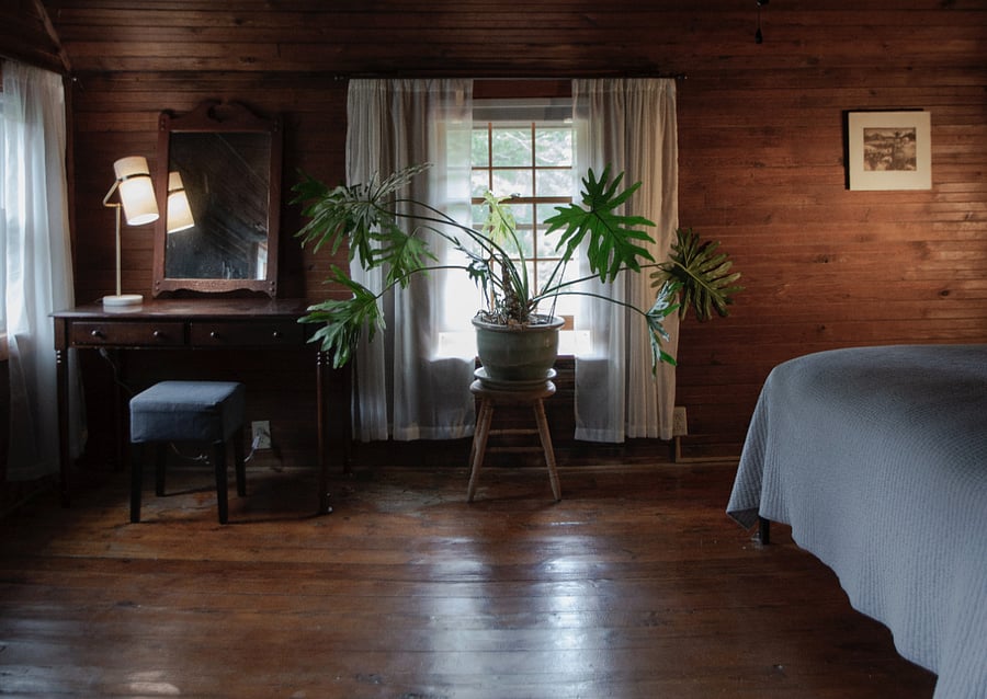 "Haven" bedroom. King-size bed, desk, lounge chair, closet.