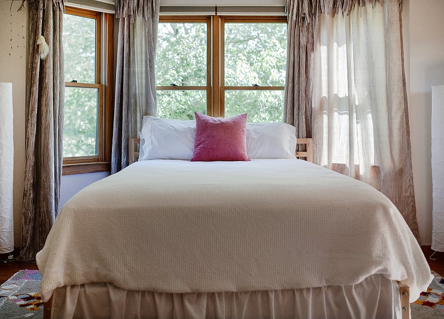 "Treetops" bedroom. Queen size bed, arm chair, desk, closet.