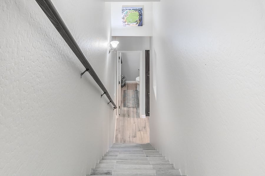 View from atop stairs looking down at half bath apnd inspirational picture of the iconic 16th hole at TPC Scottsdale, home of The Phoenix Open! 