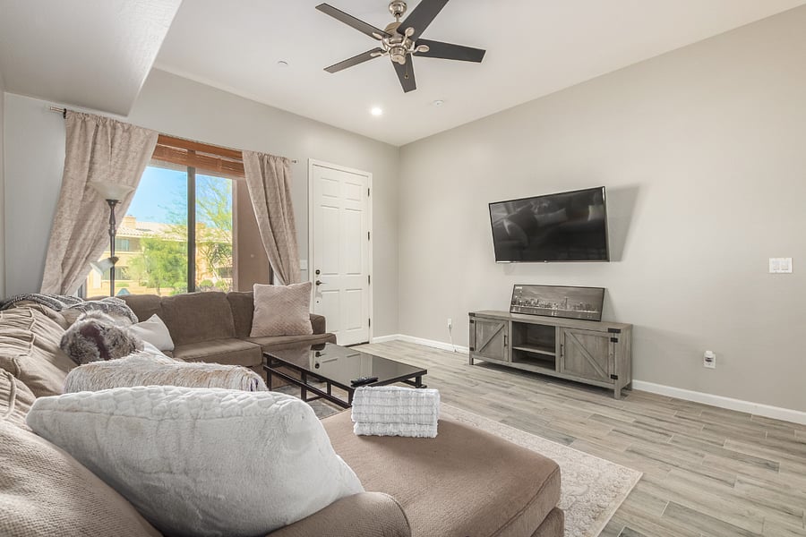 Chaise couch with coffee table and LG TV with variety of streaming apps YouTube TV, Netflix, Amazon, etc.