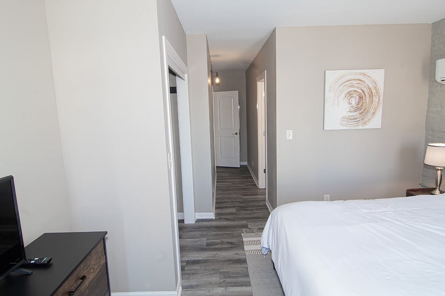 Bathroom in the door to the right. Entrance to bedroom from upstairs hallway straight ahead.