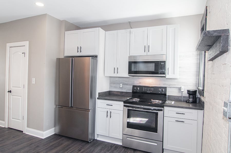 Stainless steel appliances. Refrigerator has water and ice maker on the inside.  Electric range.