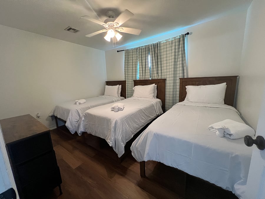 Bedroom 1 with three twin beds