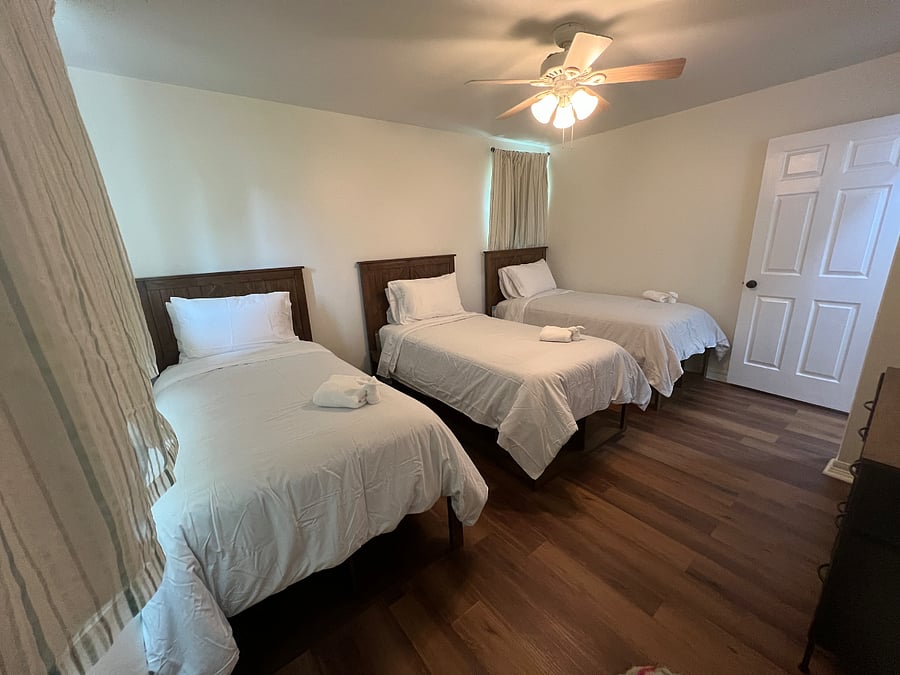 Bedroom 2 with three twin beds