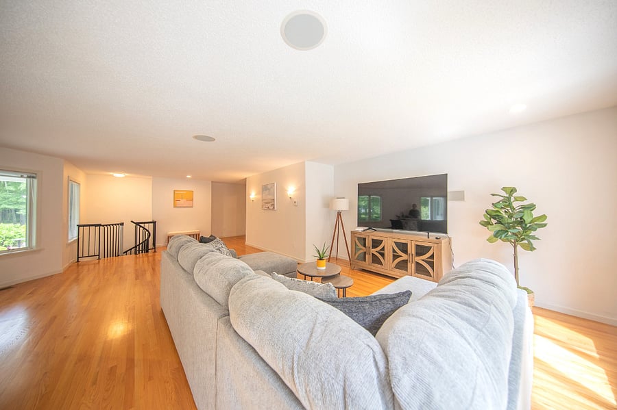 75 inch smart tv in living room and sectional couch. 