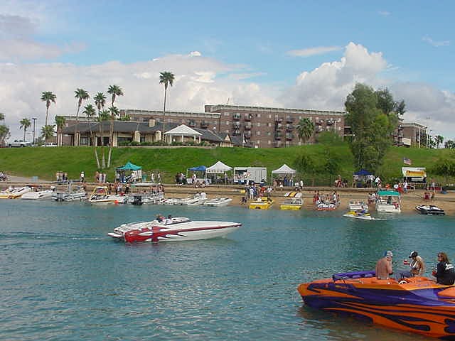 LAKE AND SANDY BEACHES  AND CHANNEL WALK ARE  JUST A FEW SHORT STEPS FROM YOUR CONDO, SHOWN IN THE BACKROUND AT QUEENS BAY CONDO RESORT.