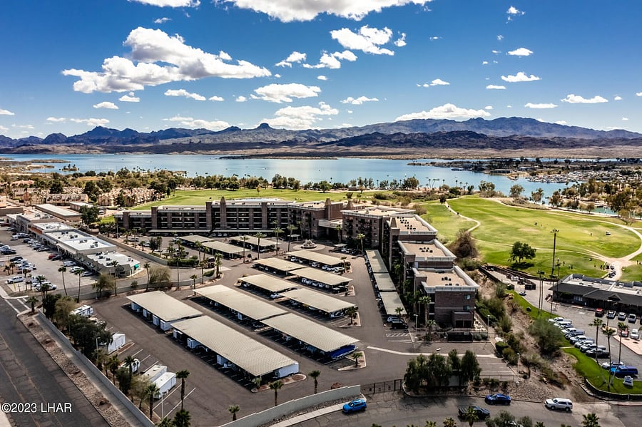 CONDO COMPLEX LINES A 9 HOLE EXECUTIVE GOLF COURSE - PUBLIC GOLF AT REASONABLE RATES IF YOU ARE A GOLFER, IF NOT, JUST ENJOY THE LAKE MOUNTAIN & SUNSET VIEWS FROM MOST OF THE CONDOS PRIVATE PATIOS. OR ENJOY THE COMMUNITY PATIOS AT THE POOL AREA.