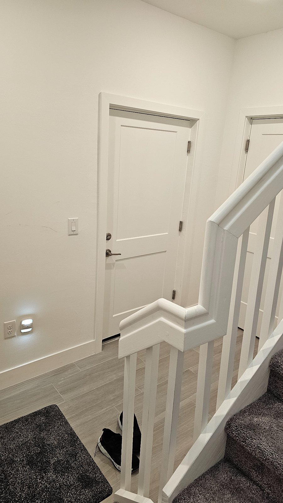 Interior front door entrance to stairs and elevator