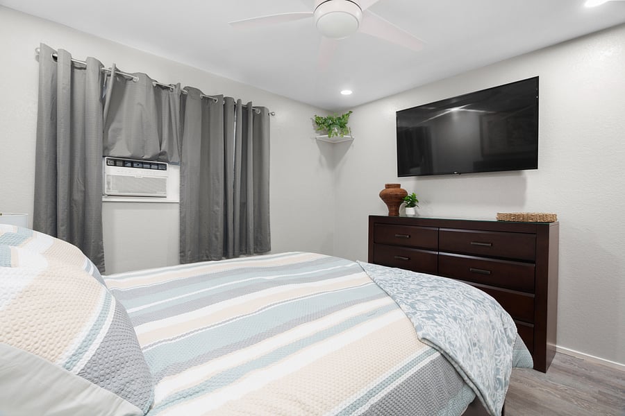 Main Bedroom with window AC and TV