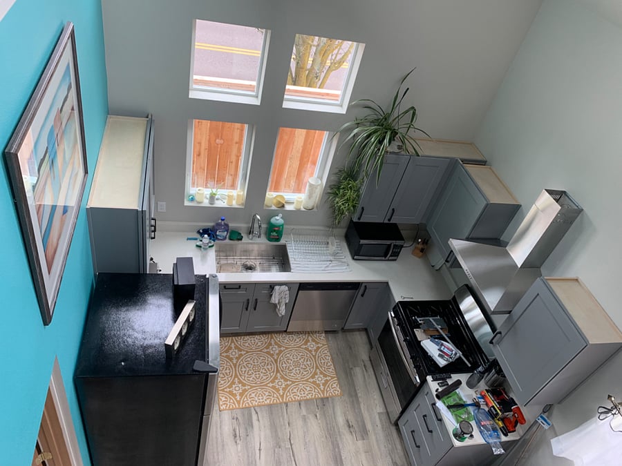 That blue kitchen wall has been painted to match the rest of the house. 