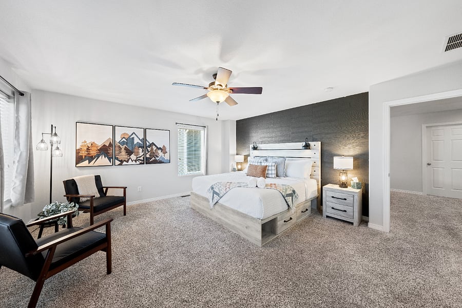 Two accent chairs + storage underneath the bed. 