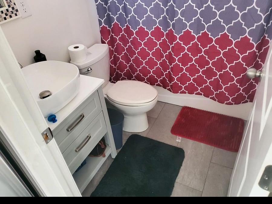 Full bathroom with bathtub.