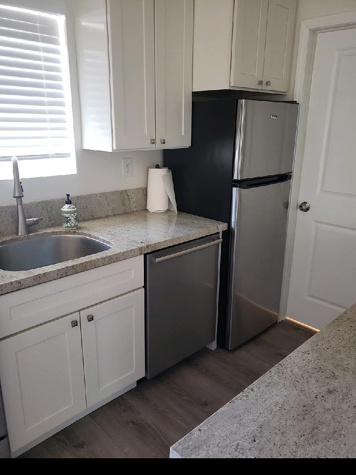 Dishwasher & Refrigerator with ice maker.