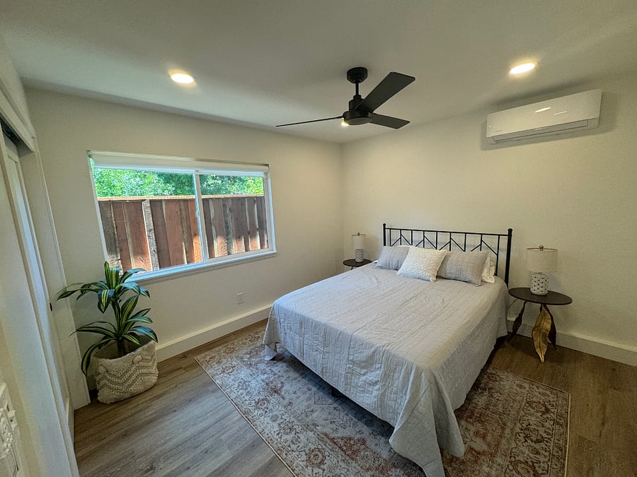 The bedroom has a large closet with drawers in it, and a very comfortable queen bed.