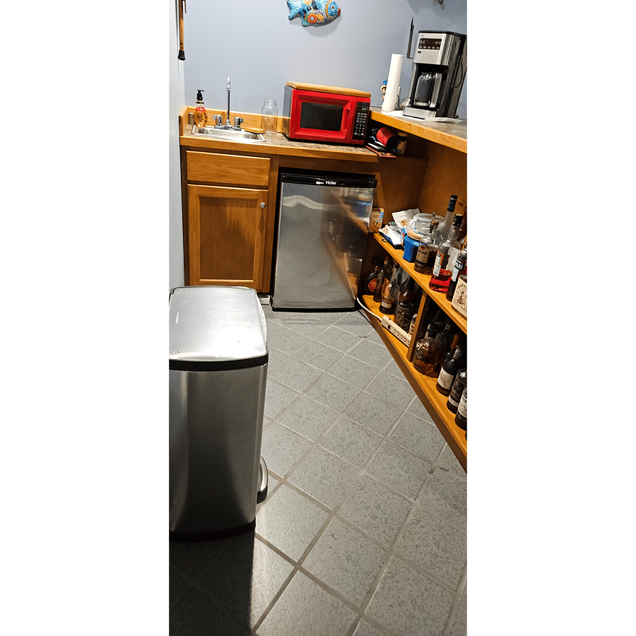 back bar area with small frig, microwave and coffee pot