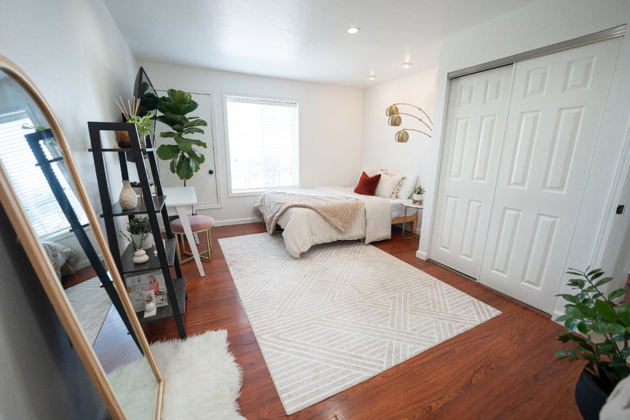 Workspace and entertainment zone in the bedroom with mounted flat-screen TV. Move-in ready for your next assignment
