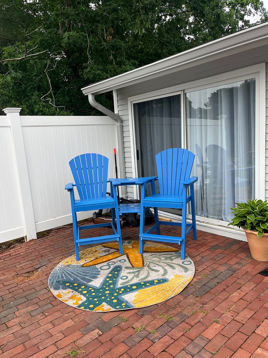 Patio with seating and grill