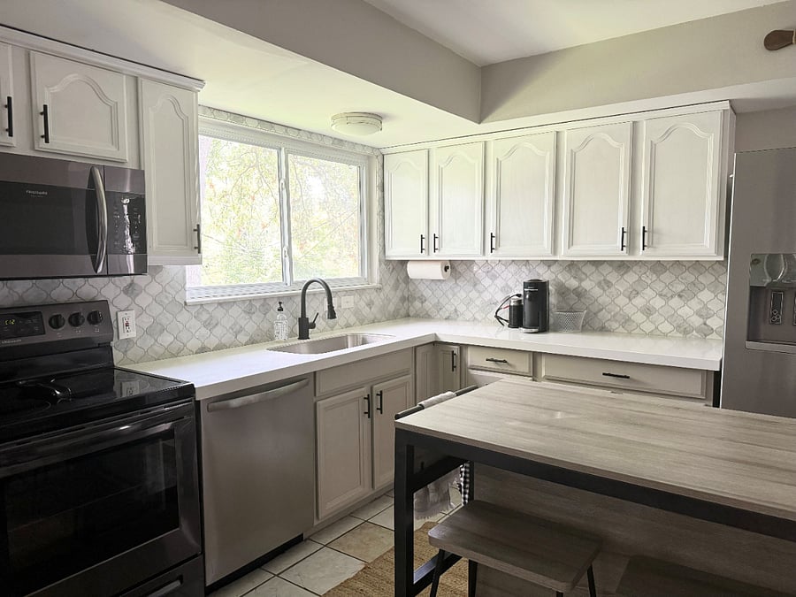 Kitchen with quartz countertops and updated backsplash. Nespresso machine included!