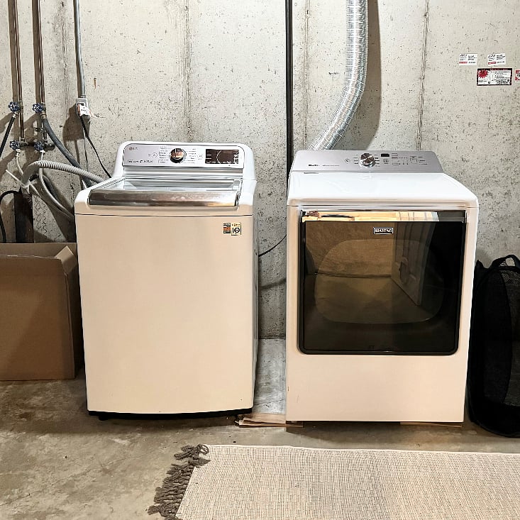 Large washer and gas dryer in basement