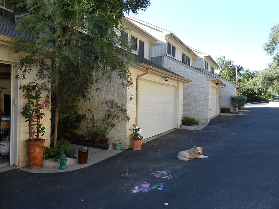 driveway and unit entrance. Unit has garage with parking for one mid size/ suv vehicle 