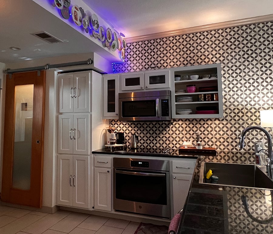 kitchen with electric cooktop and oven. 