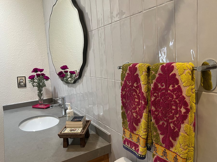 Anthropology accents in renovated bath.