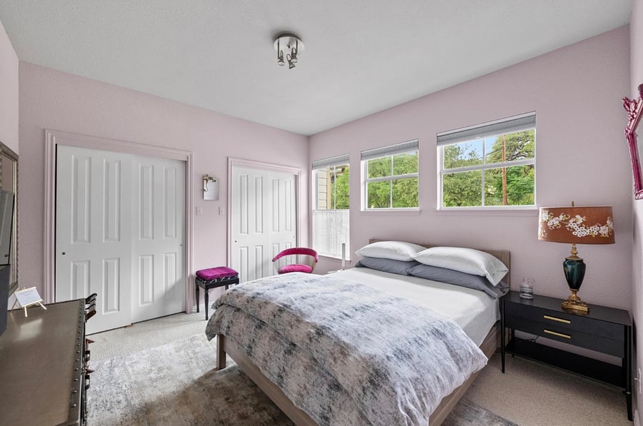 Second story bedroom with queen bed, Hotel Collection linens, blackout shades, one closet for guests. 