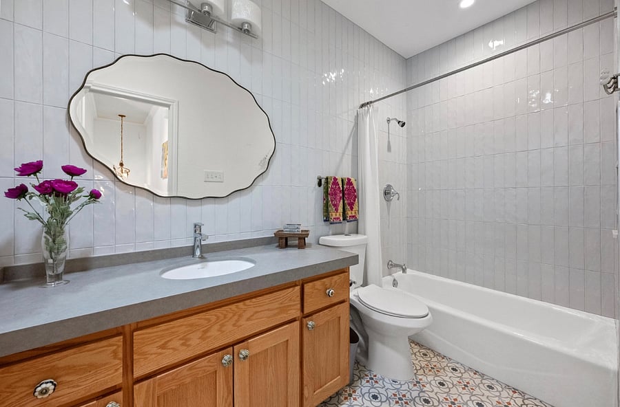 Freshly renovated, fully tiled bath shower. Hotel Collection towels and linens.