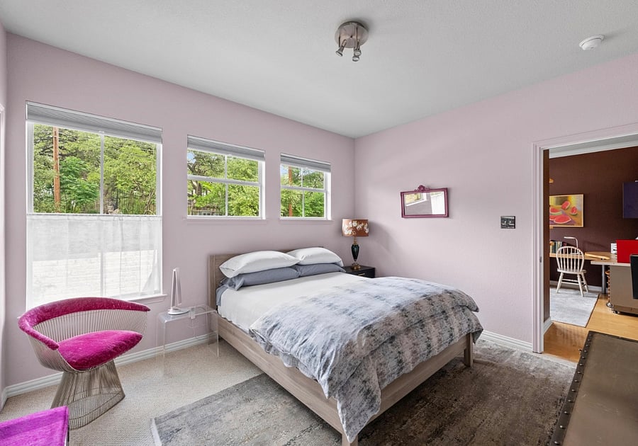 Bedroom with queen bed, Hotel Collection linens, closet, 55" QLED TV, fan with remote, blackout shades. 