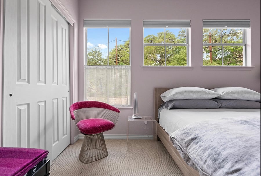 Bedroom with view of neighborhood. privacy curtains, blackout shades, Hotel Collection linens, closet. 