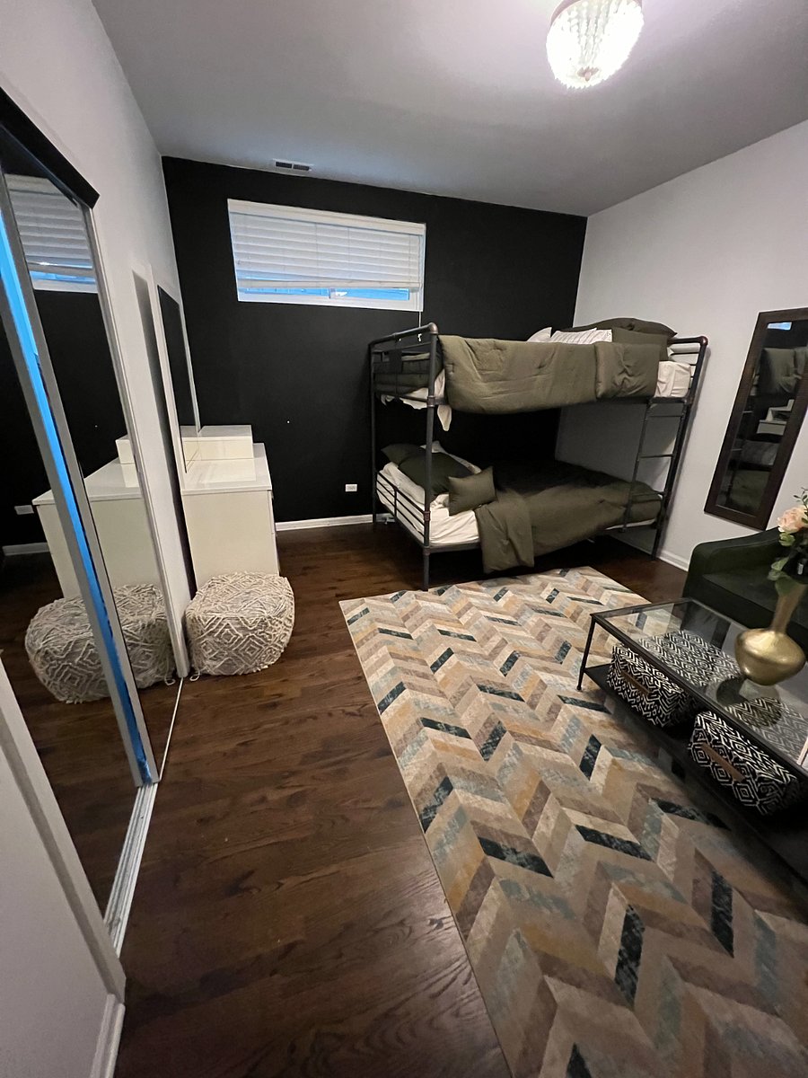 Lower Level Bedroom with Queen Bunk Beds and Lounge