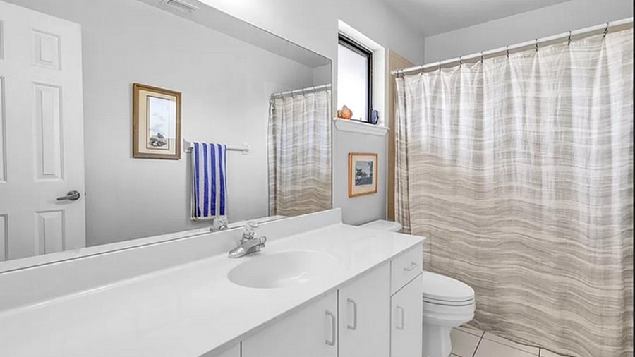 Second bathroom with bathtub and shower