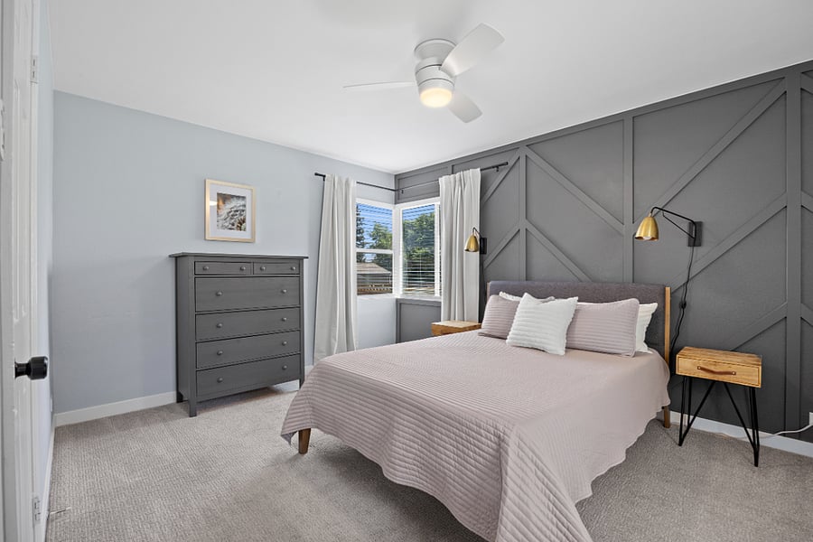 Primary bedroom with natural light & queen bed. Blackout curtains on all bedroom windows.