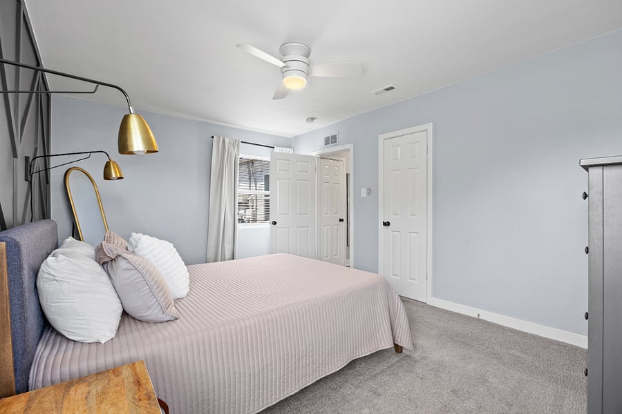 Ceiling fans and blackout curtains in each bedroom.