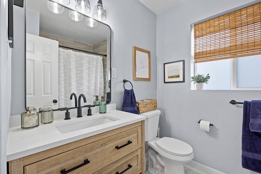 Bright, newly renovated bathroom with full tub + shower.