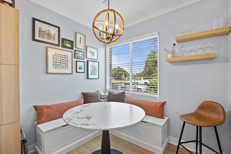 Dining nook has extra storage in the bench.