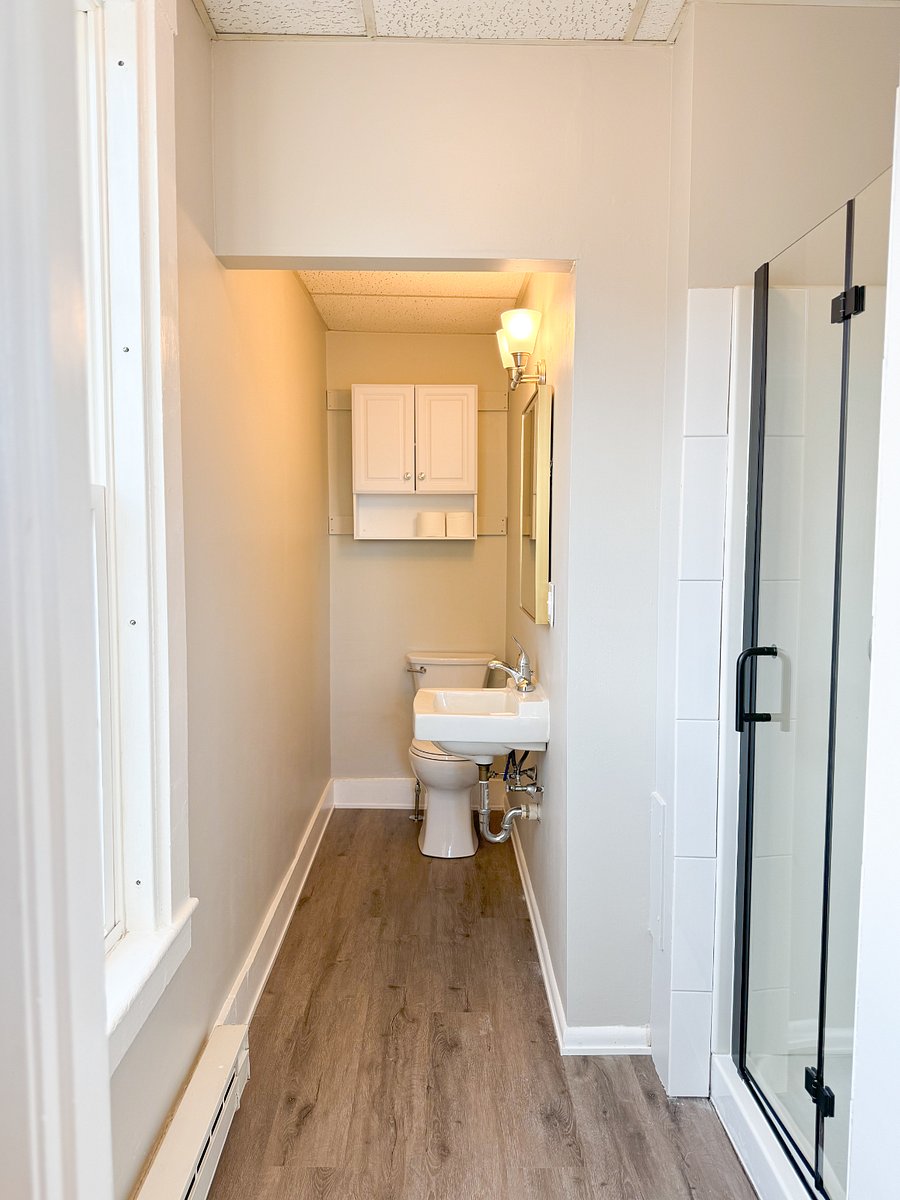 Experience the fresh, clean, and inviting atmosphere of the newly renovated bathroom.